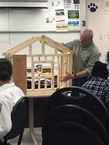 Students in a Santa Rosa classroom build a model house.