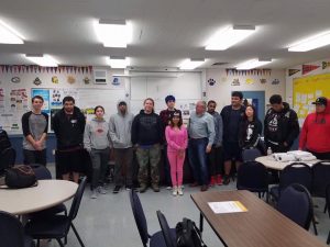 A group of people posing for a picture in a Santa Rosa classroom.