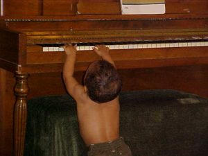 A child performing on a piano at The LIME Foundation of Santa Rosa, a Sonoma County non-profit.