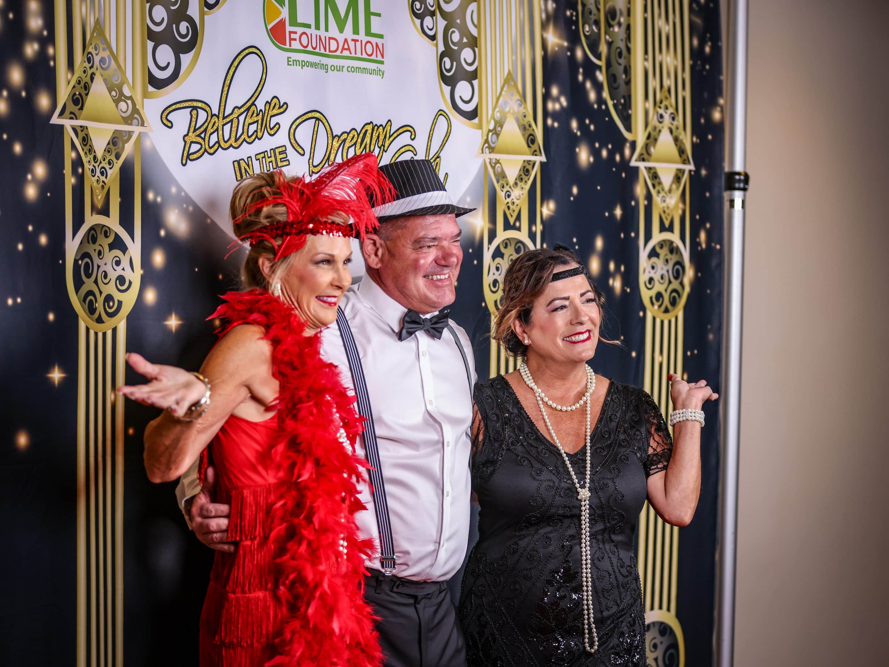 A group of people posing for a photo at a 1920's themed party hosted by The LIME Foundation of Santa Rosa, a Santa Rosa Non-Profit.