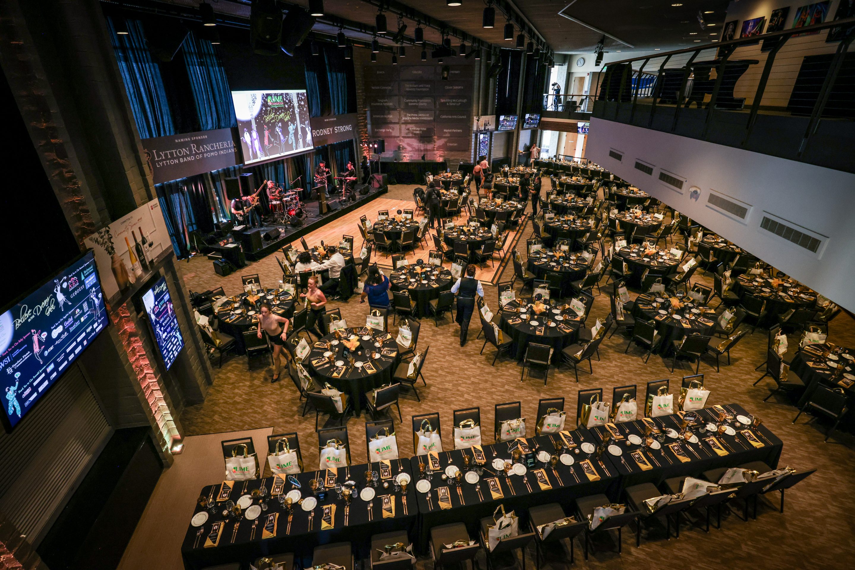 An aerial view of a large room with tables and chairs at The LIME Foundation of Santa Rosa.