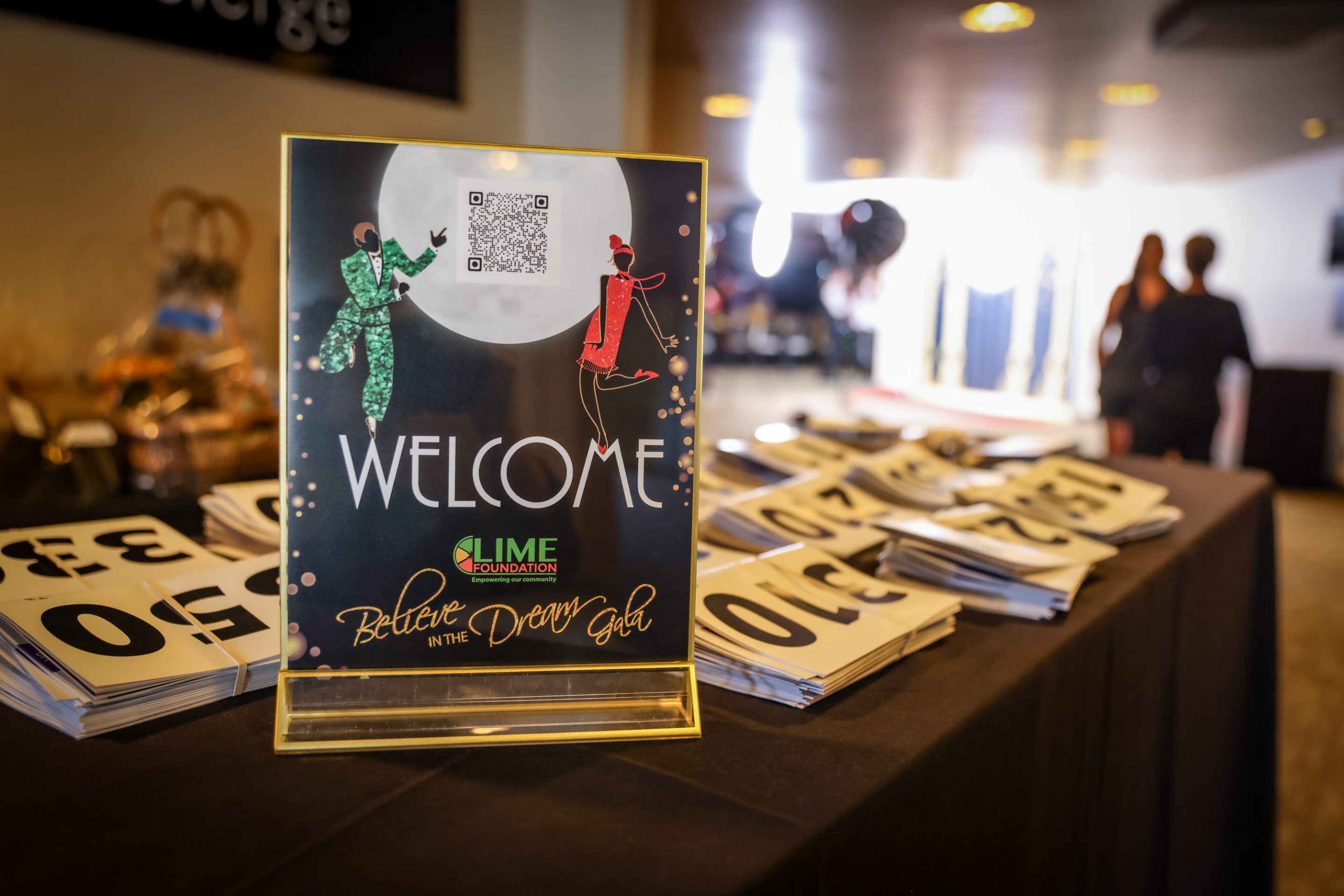 A table with a welcome sign from The LIME Foundation of Santa Rosa.