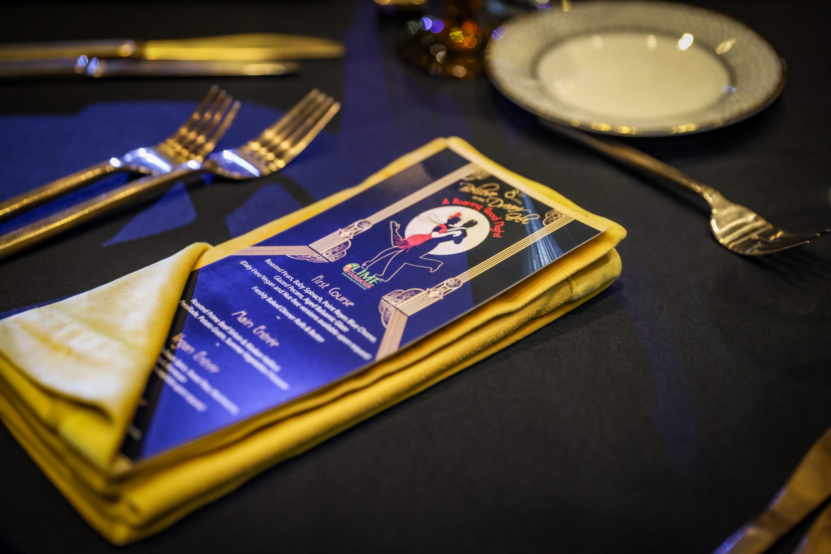 A table setting with a napkin, fork, and knife at a Santa Rosa Non-Profit event.