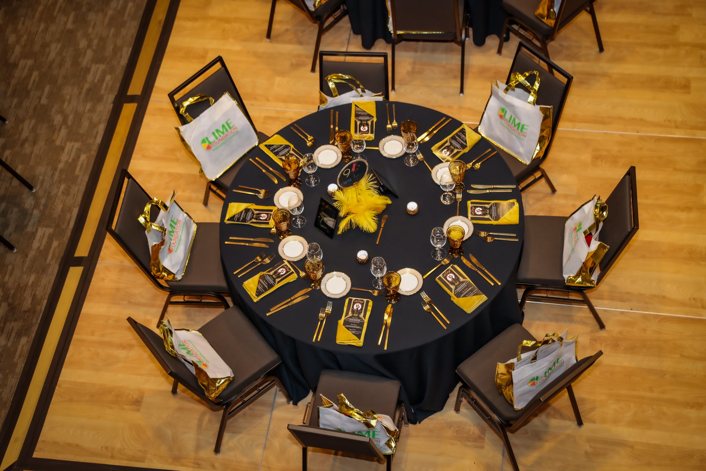 A black and yellow table setting for The LIME Foundation of Santa Rosa.
