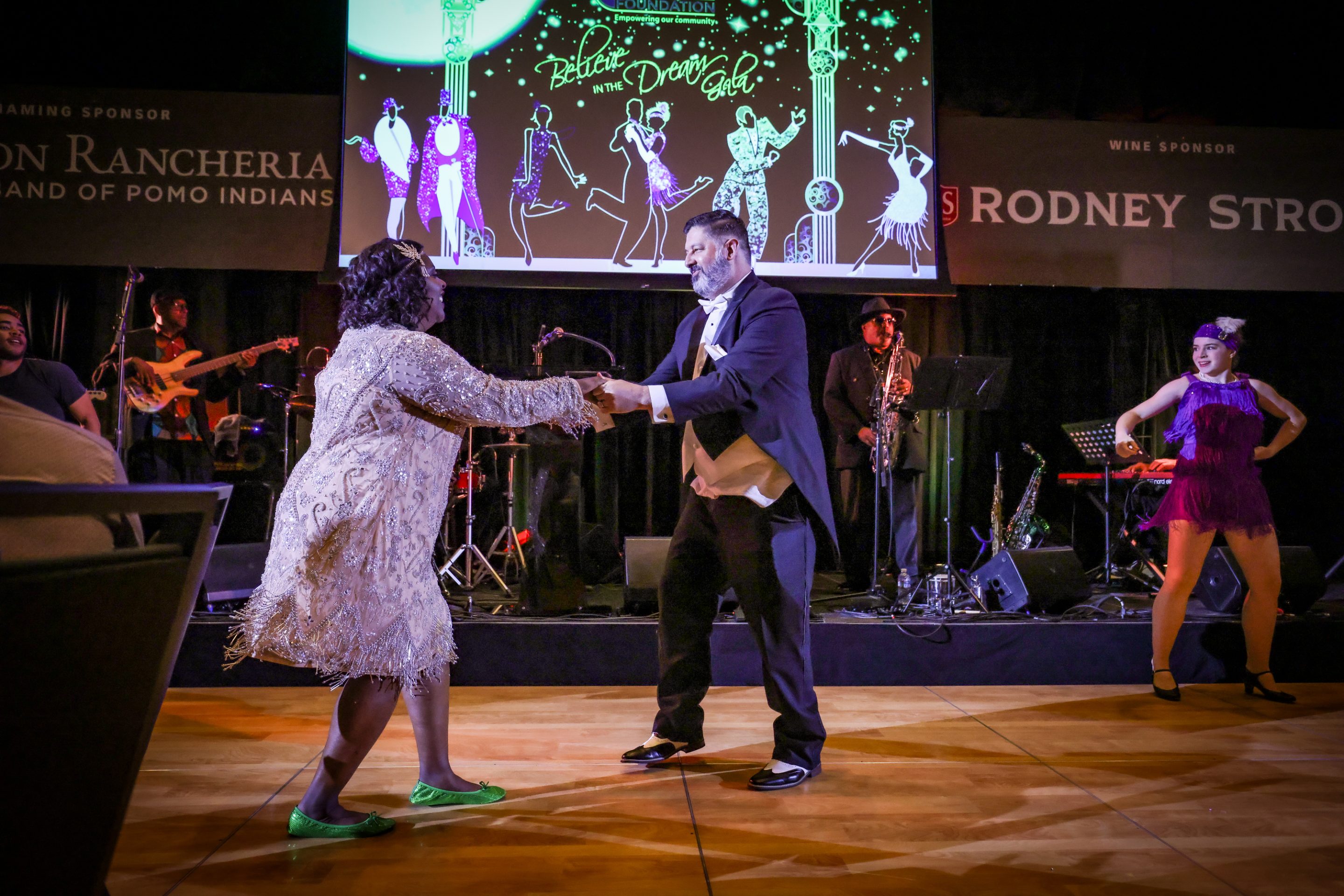 A man and woman gracefully dance on stage at The LIME Foundation of Santa Rosa's Sonoma County non-profit event.