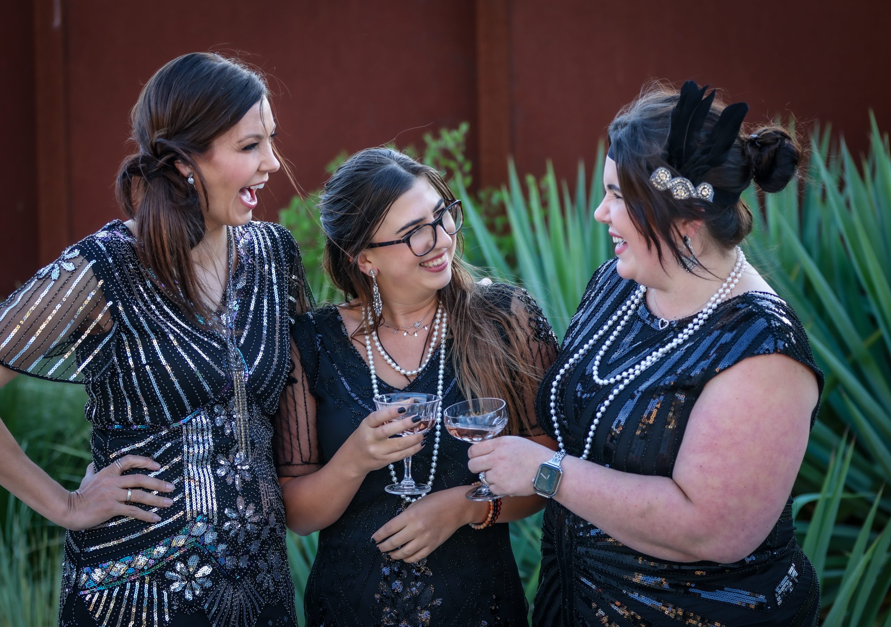 A group of women in black dresses are holding wine glasses at The LIME Foundation event in Santa Rosa.