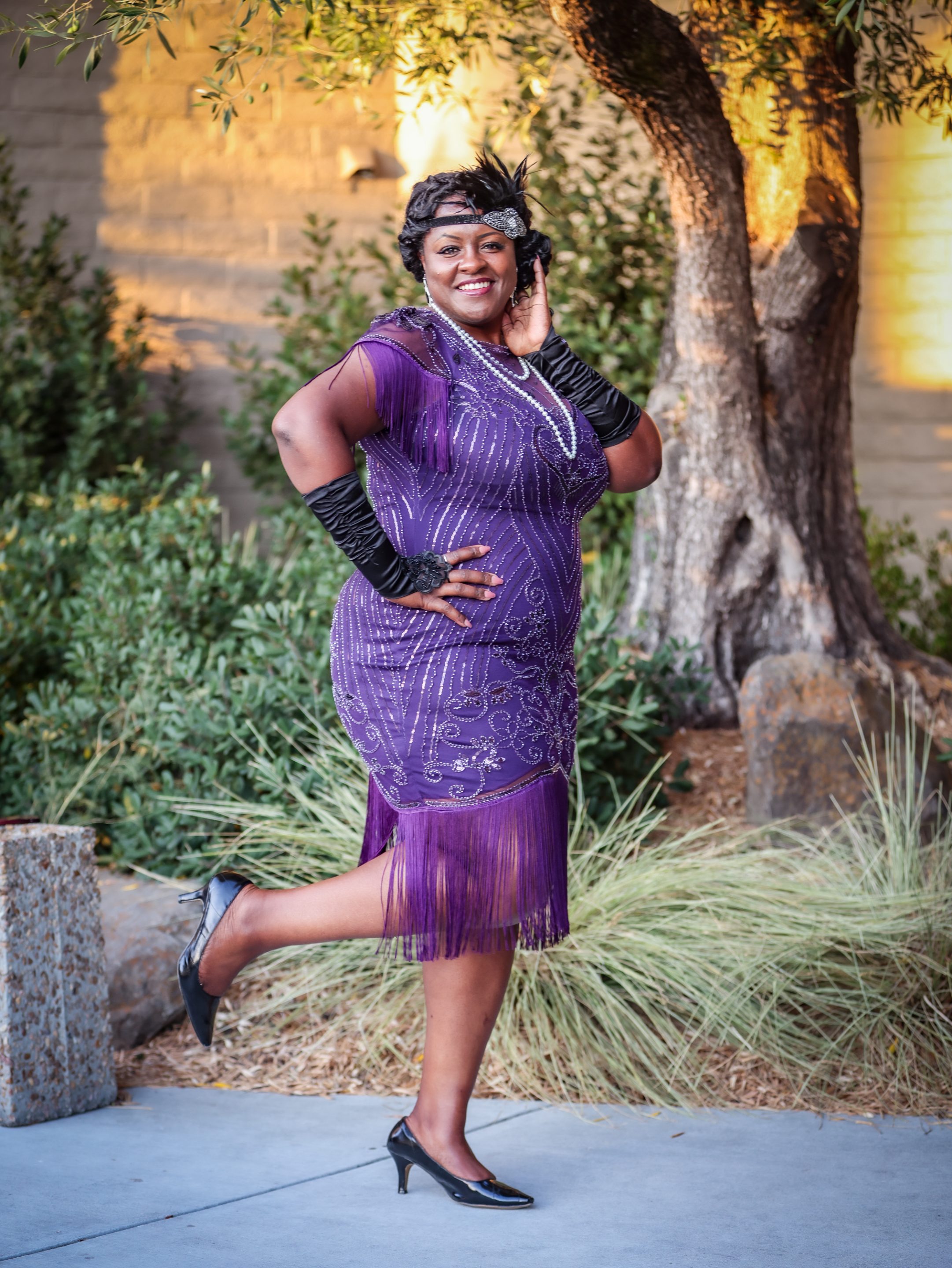 A woman in a purple dress posing for a photo at The LIME Foundation of Santa Rosa.