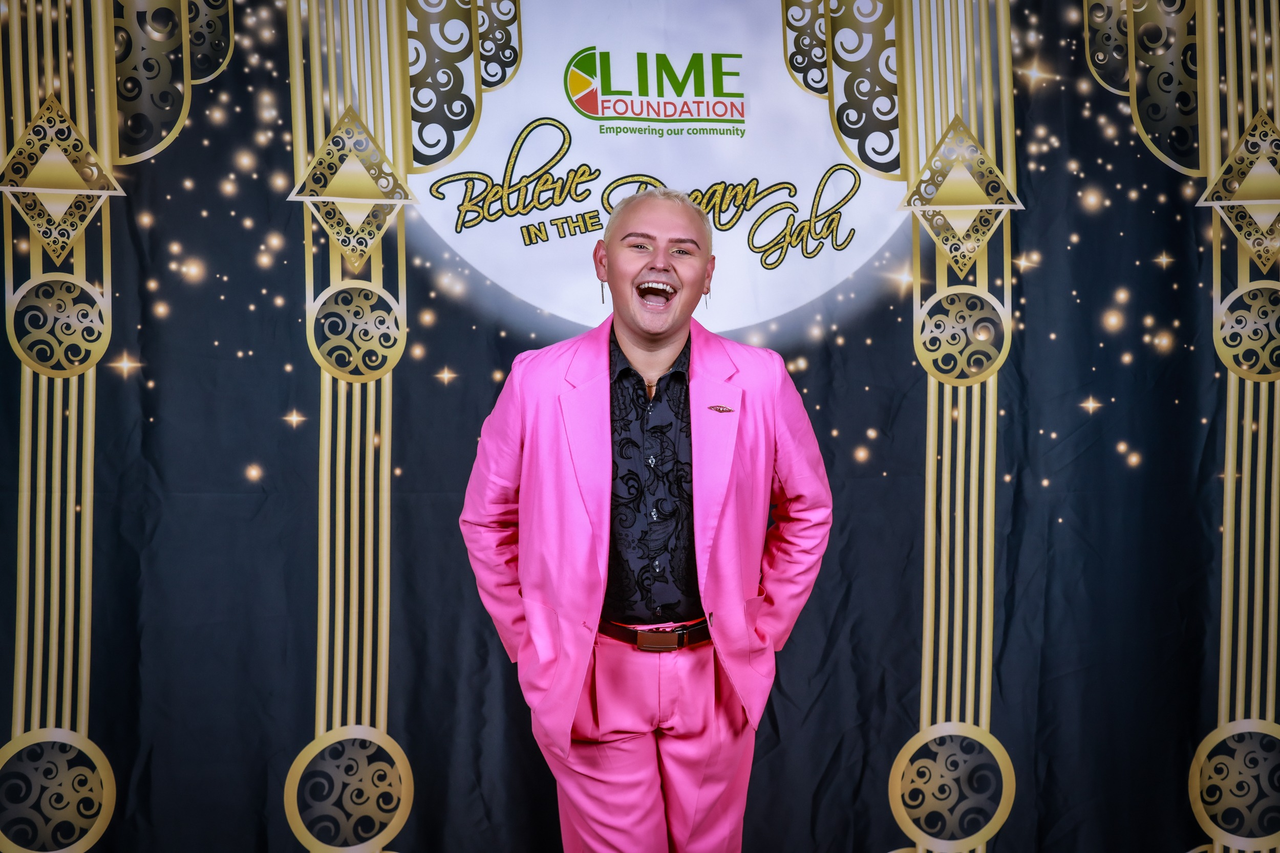 A man in a pink suit posing for a photo at a Santa Rosa Non-Profit event.