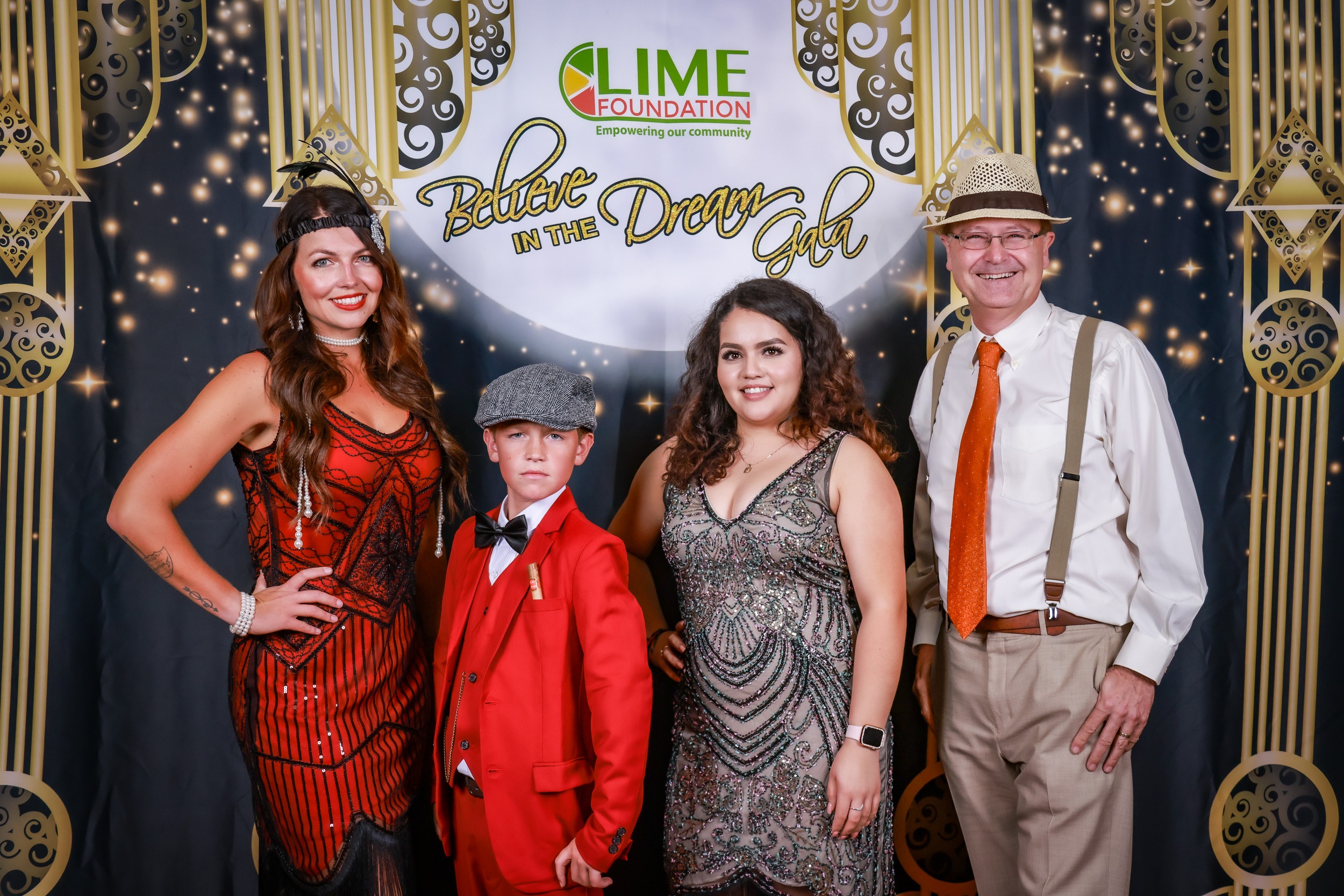 A group of people posing for a photo at a Santa Rosa Non-Profit party hosted by The LIME Foundation.