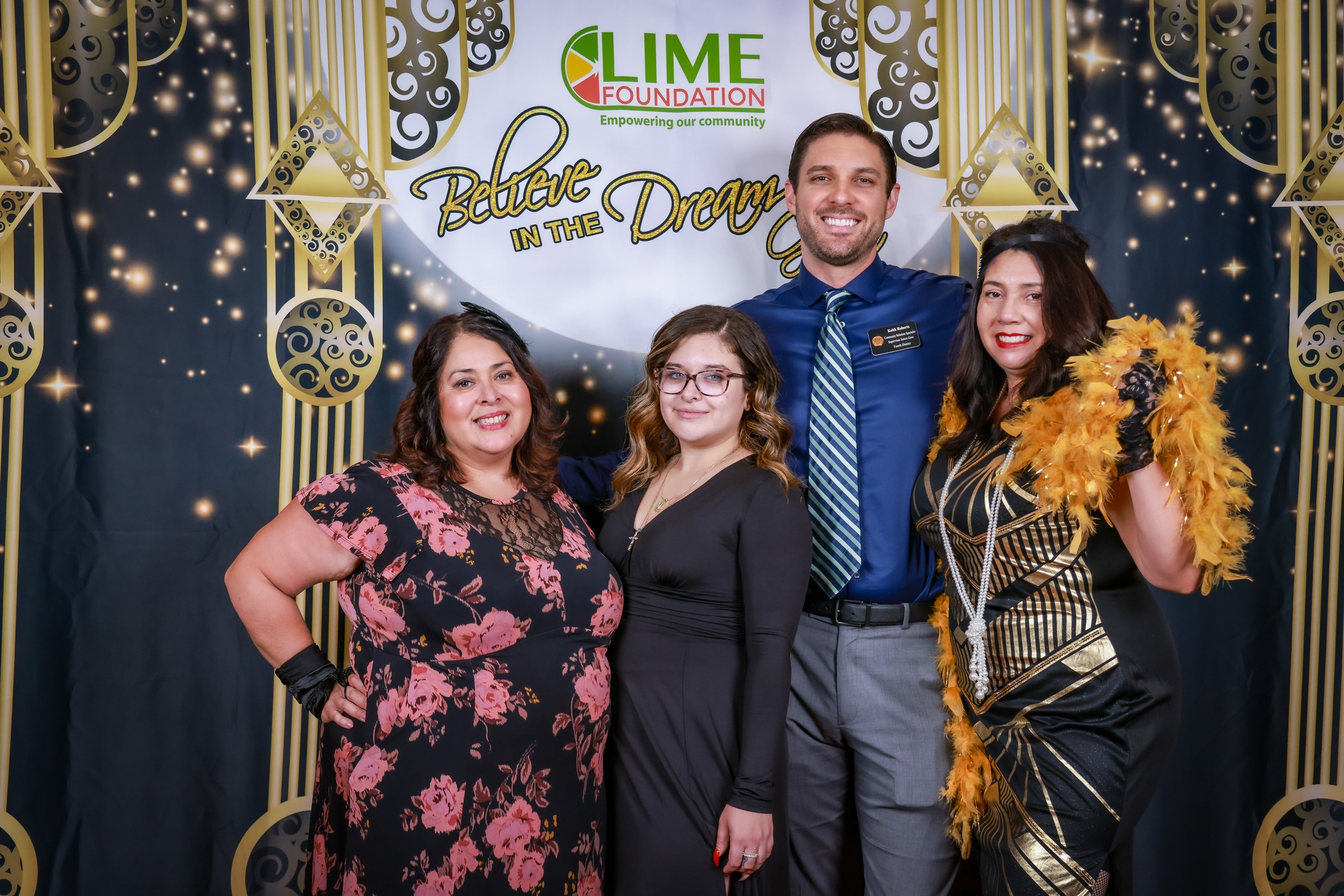 A group of people posing for a photo at a party hosted by The LIME Foundation of Santa Rosa.