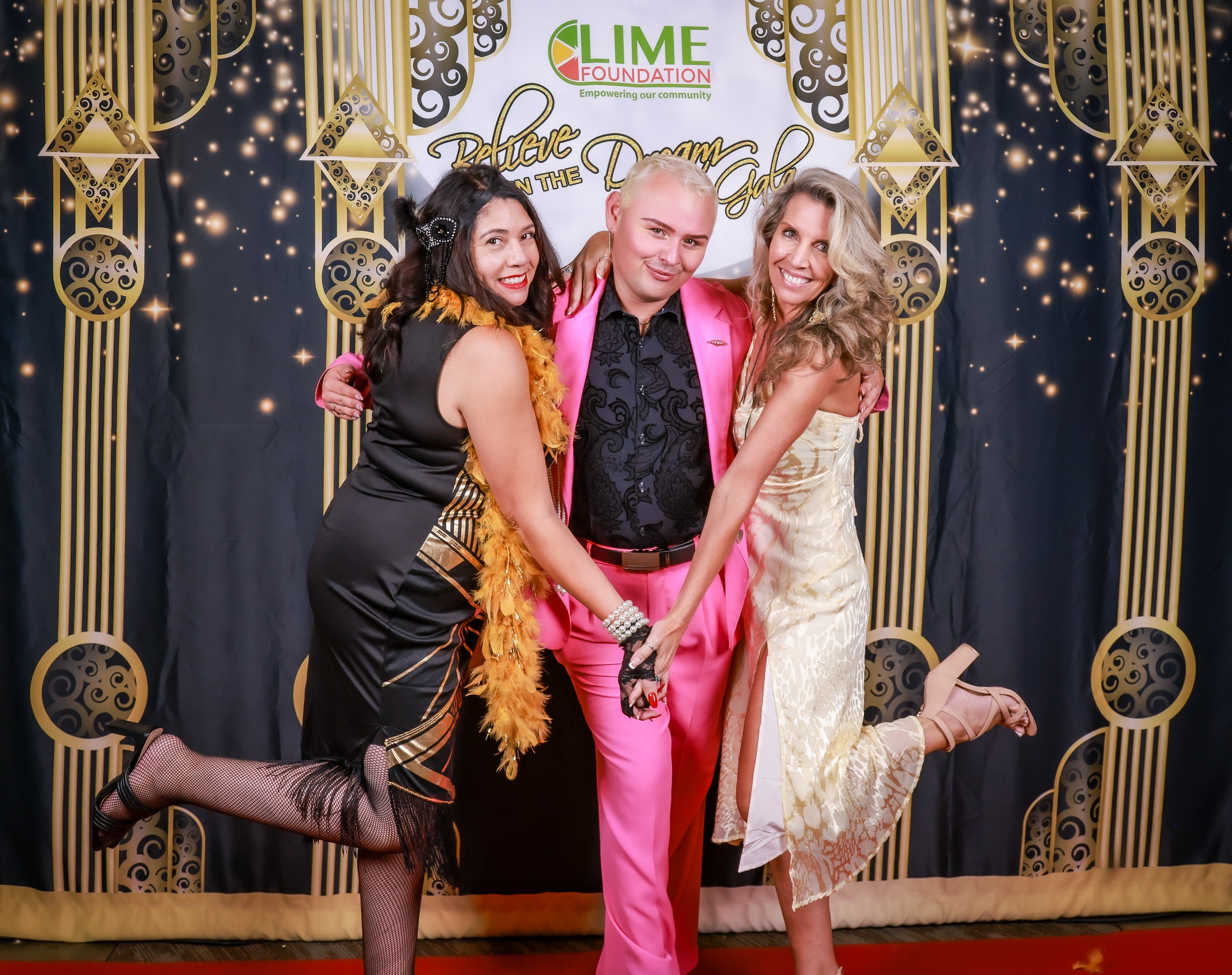 Three people posing for a photo at a gala event hosted by LIME Foundation in Sonoma County.