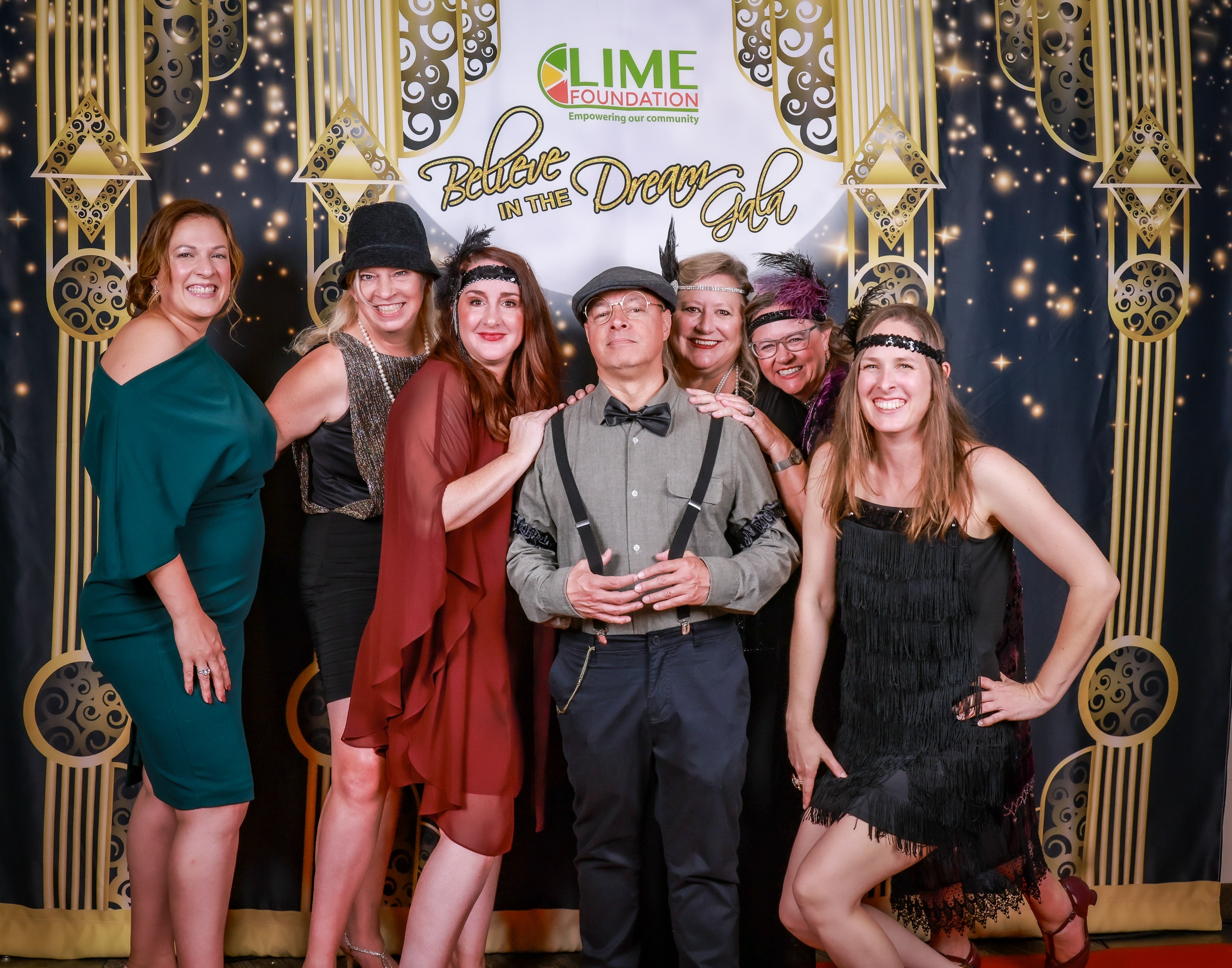 A group of people posing for a picture at a red carpet event hosted by The LIME Foundation of Santa Rosa.