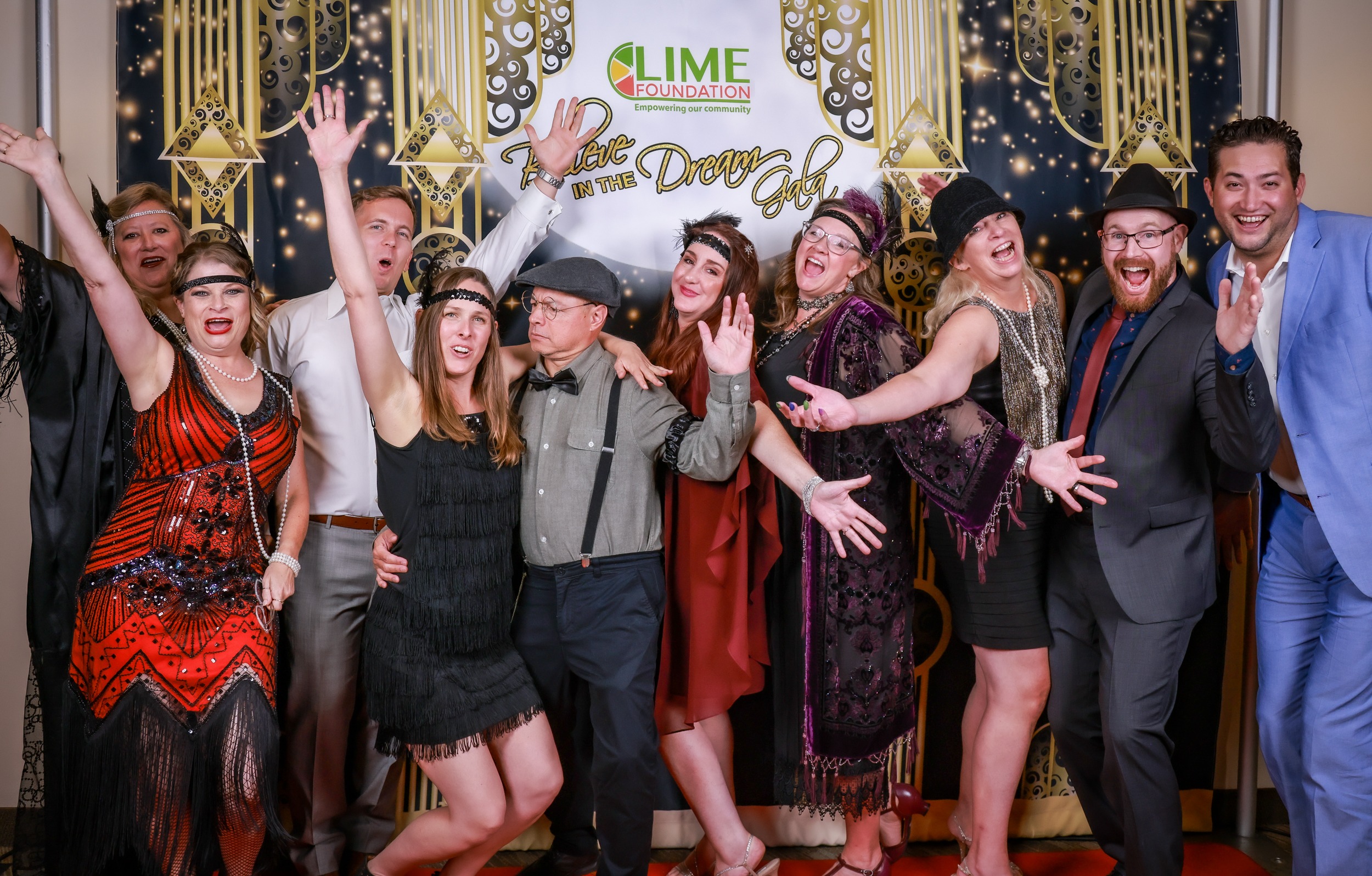 A group of people posing for a photo at a party organized by The LIME Foundation of Santa Rosa.