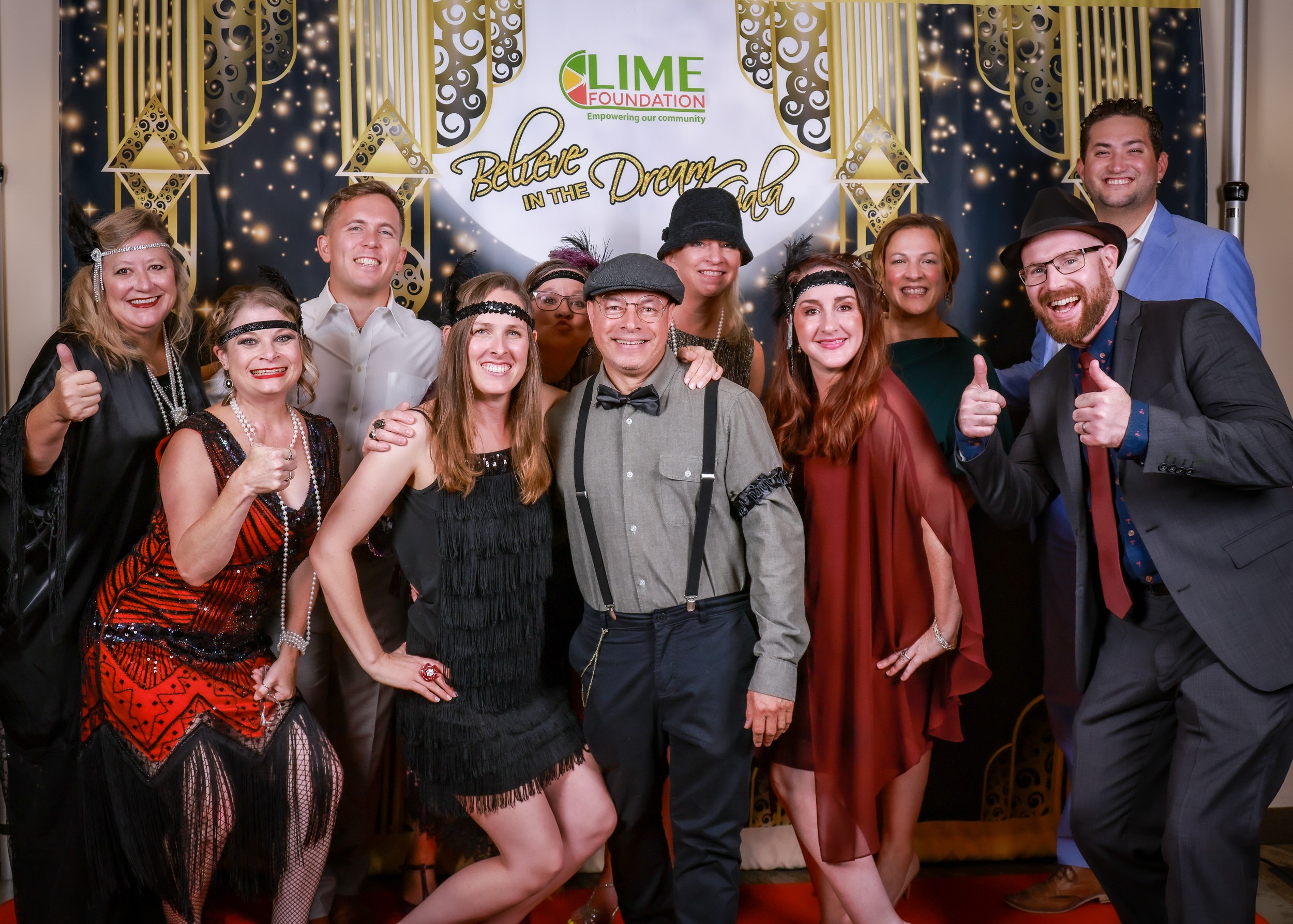 A group of people posing for a photo at a party hosted by the LIME Foundation in Santa Rosa.