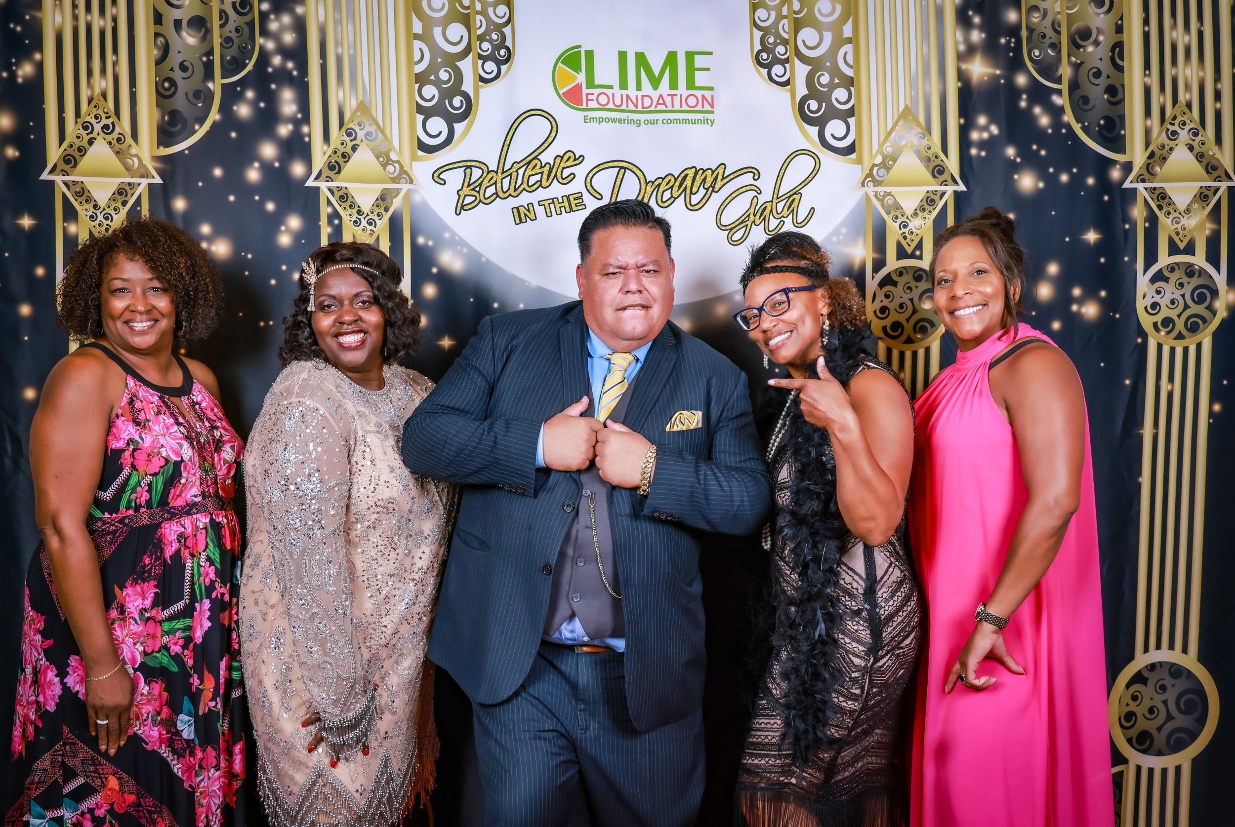 A group of people posing for a photo at a LIME Foundation event.