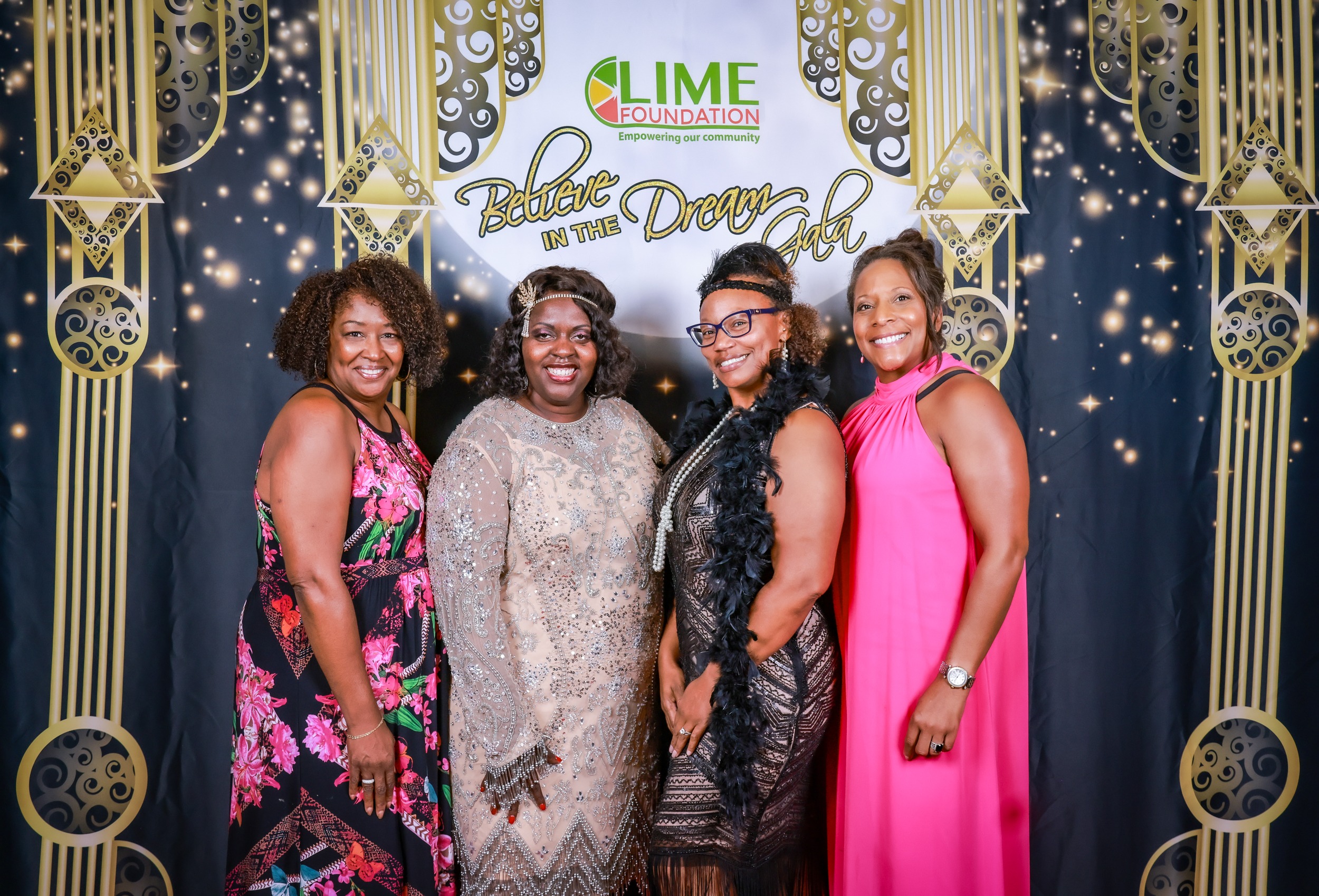 Four women posing for a photo at a LIME Foundation event.