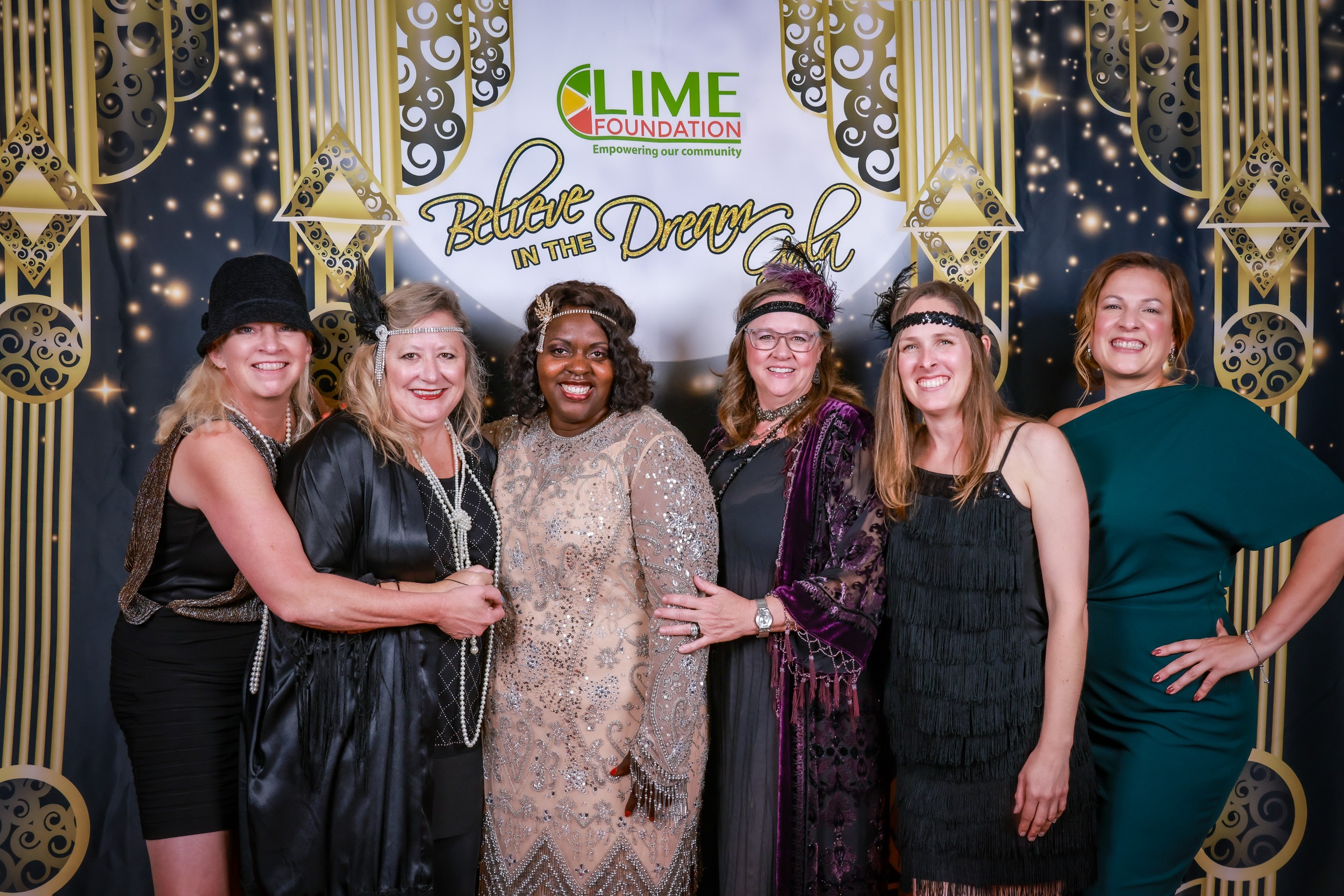 A group of women posing for a photo at a 1920's themed party hosted by The LIME Foundation of Santa Rosa, a Sonoma County Non-Profit.