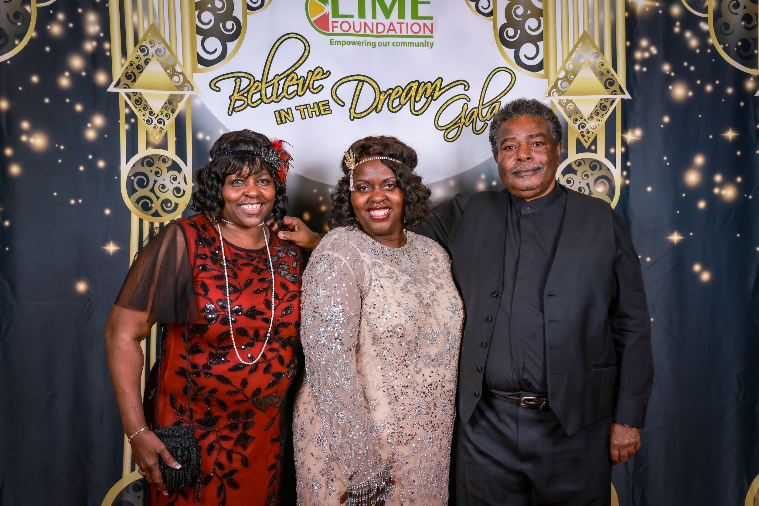 A group of people posing for a photo at a red carpet event hosted by The LIME Foundation of Santa Rosa.