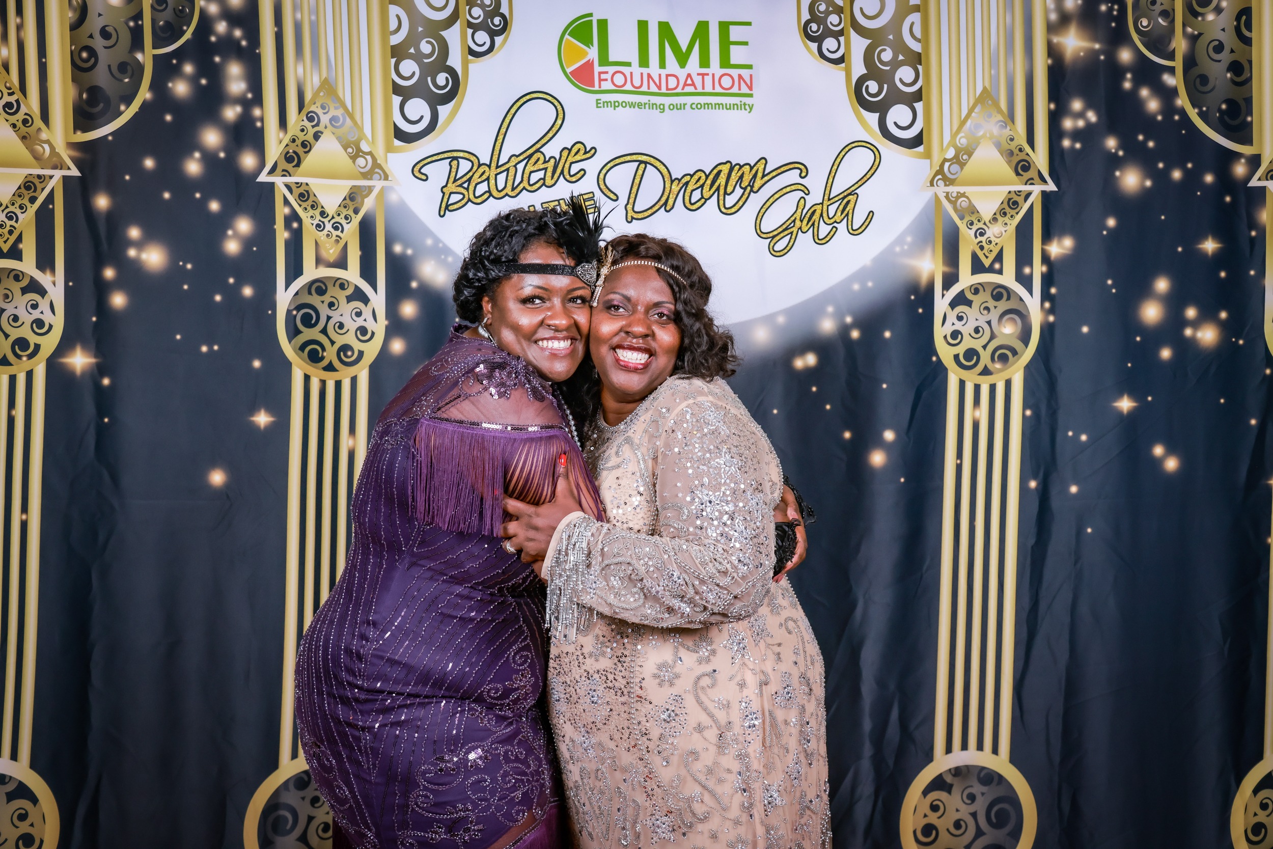 Two women posing for a photo at a party hosted by The LIME Foundation of Santa Rosa in Sonoma County.