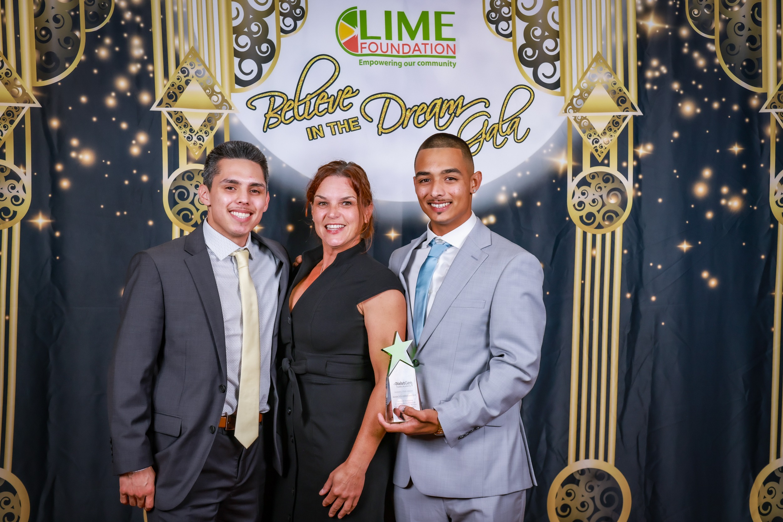 Three people posing for a picture in front of a backdrop at The LIME Foundation of Santa Rosa.