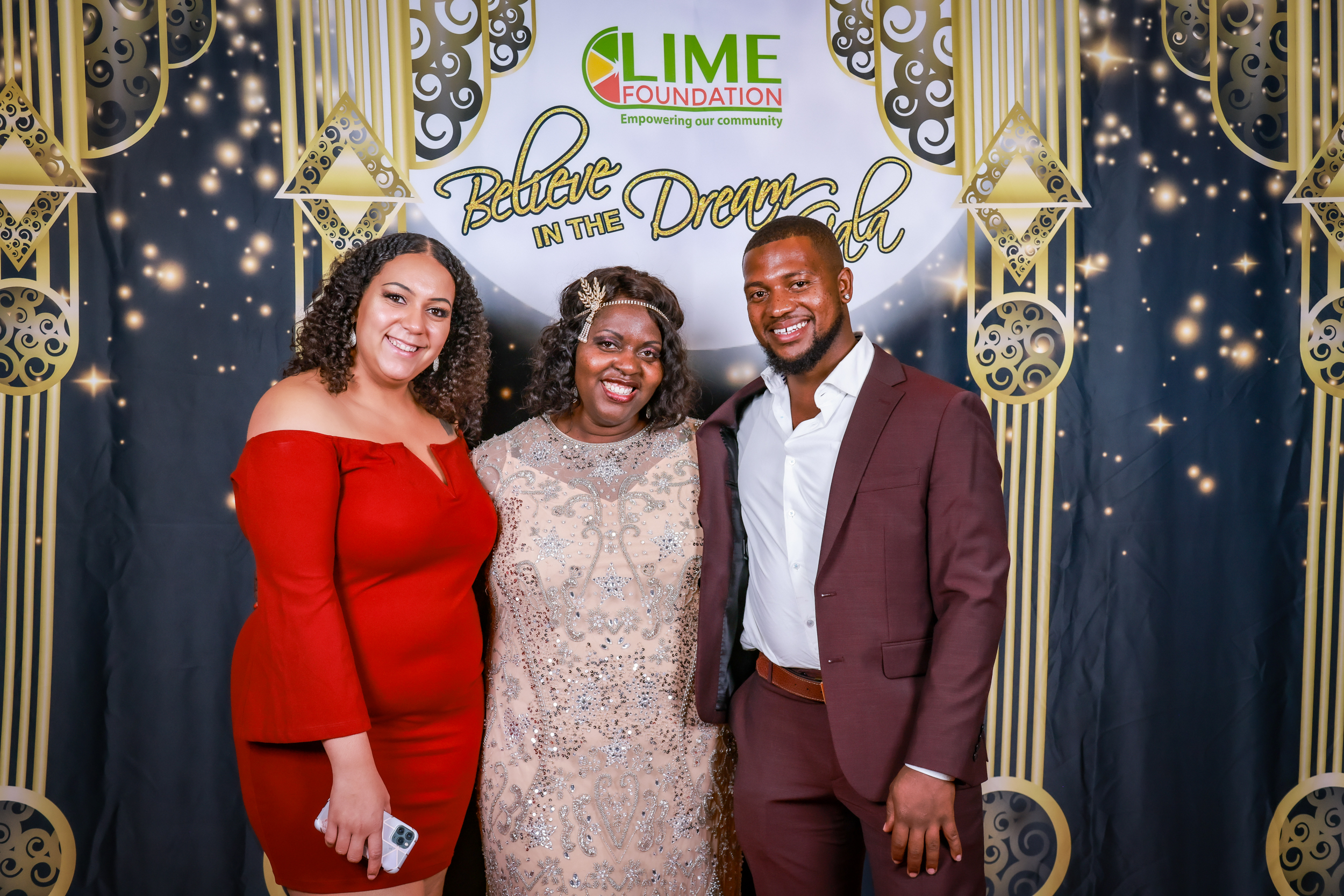 Three people posing for a photo at a Santa Rosa non-profit event hosted by The LIME Foundation.