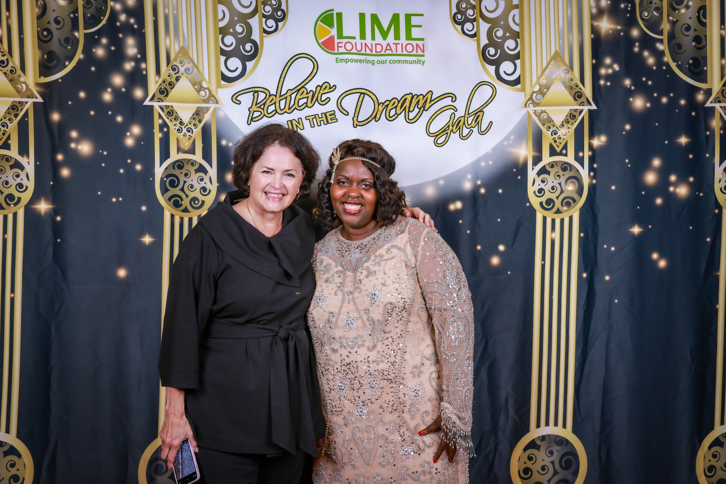 Two women posing for a photo at an event held by The LIME Foundation of Santa Rosa.