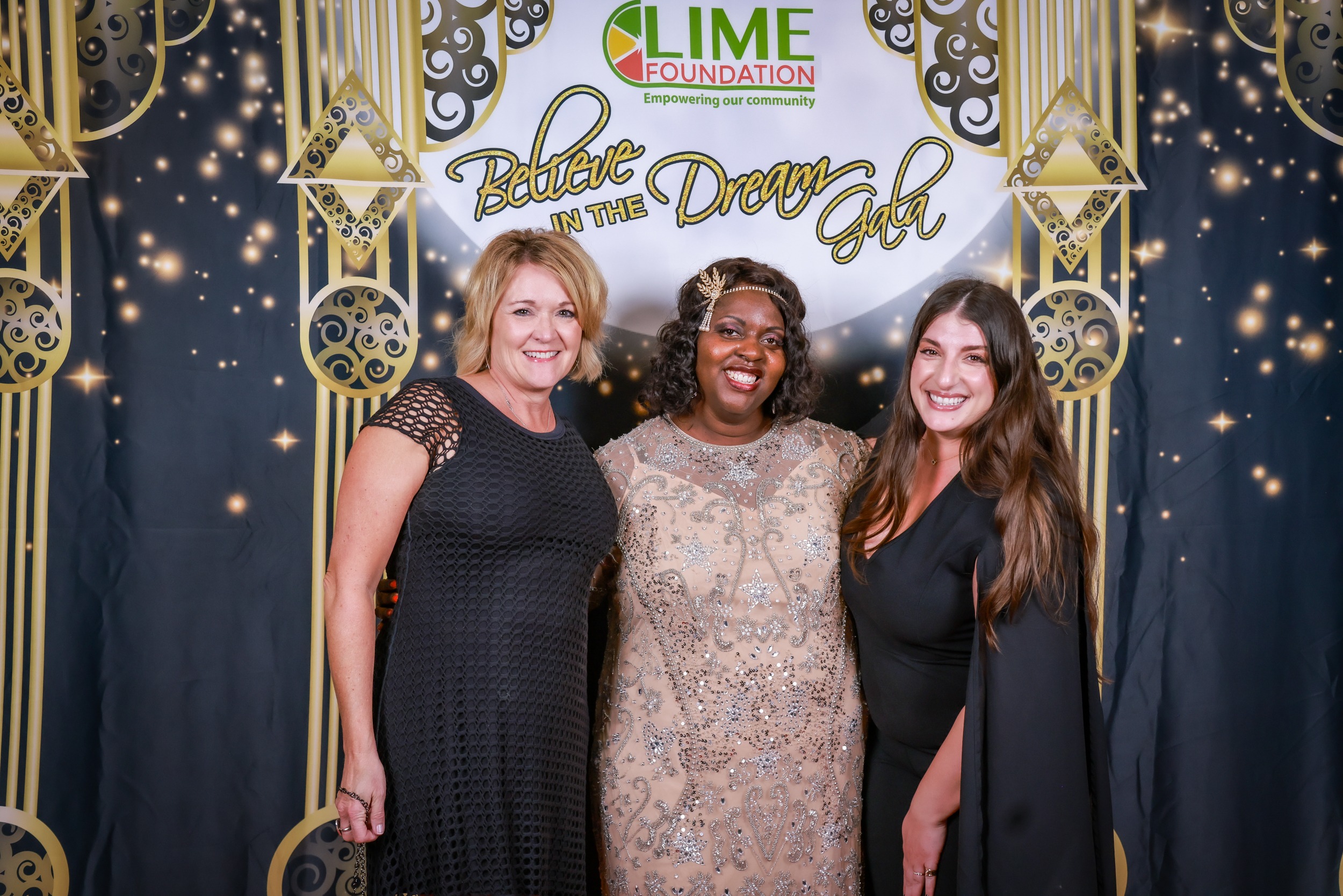 Three women posing for a photo at an event hosted by The LIME Foundation in Santa Rosa.