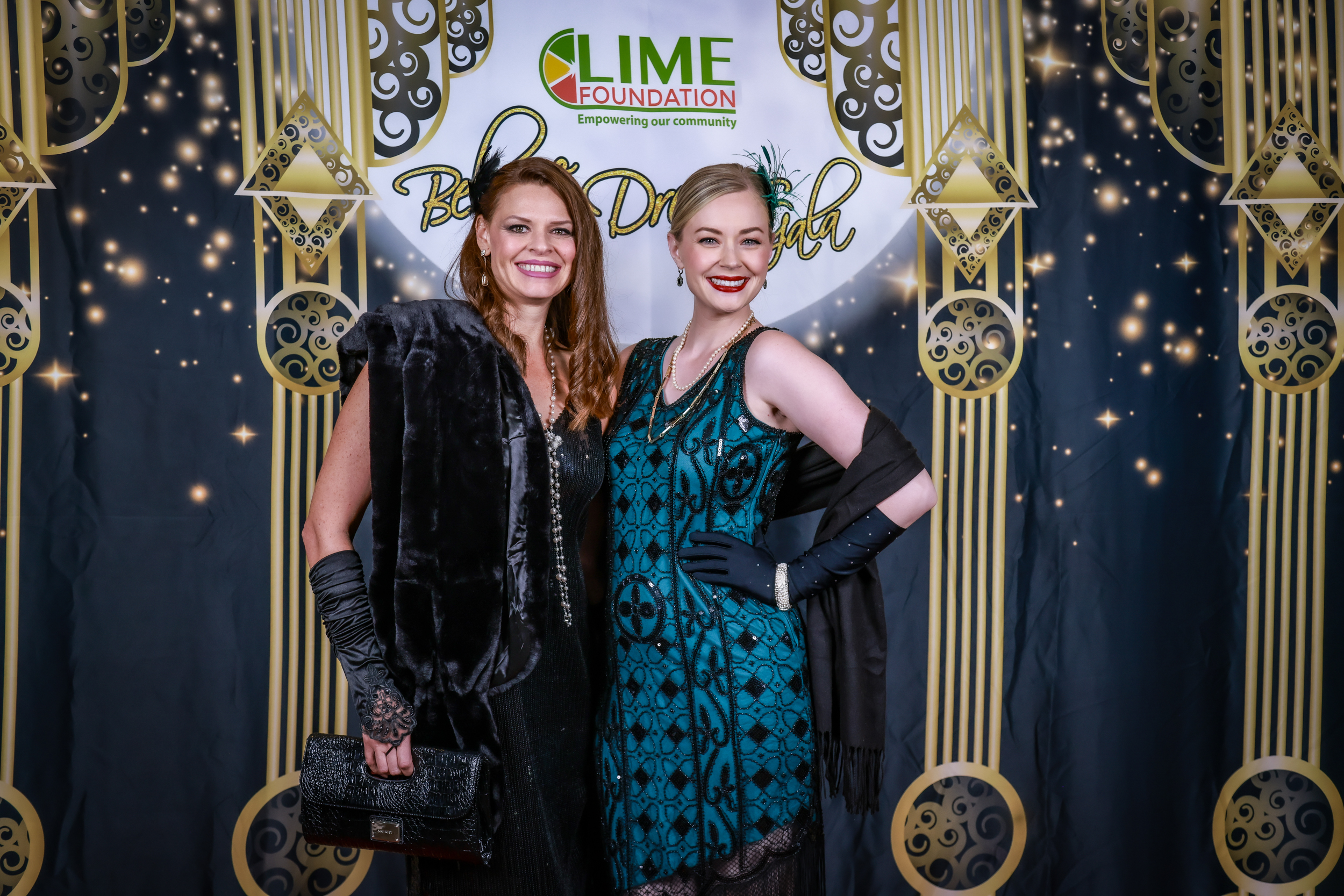 Two women posing for a photo at a Lime Foundation event.