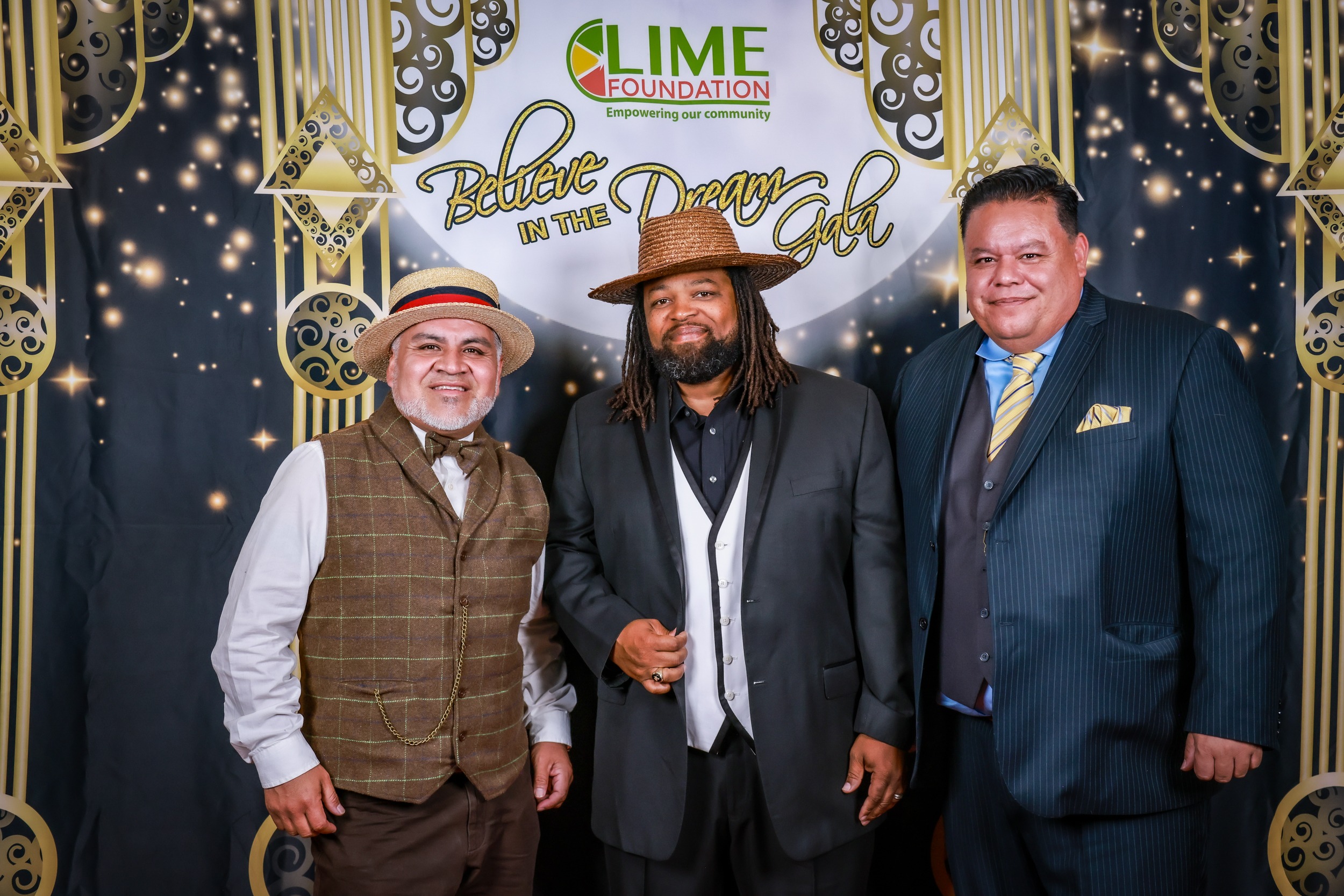 Three men standing next to each other at a party hosted by the LIME Foundation of Santa Rosa.