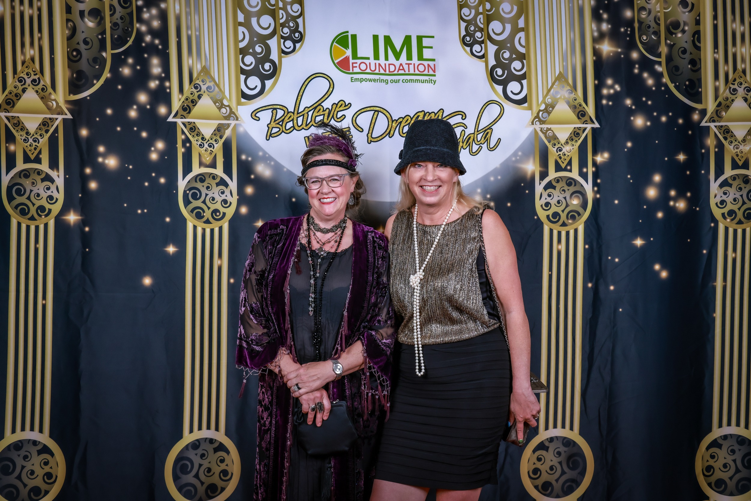 Two women posing for a photo at a Santa Rosa non-profit event organized by The LIME Foundation.