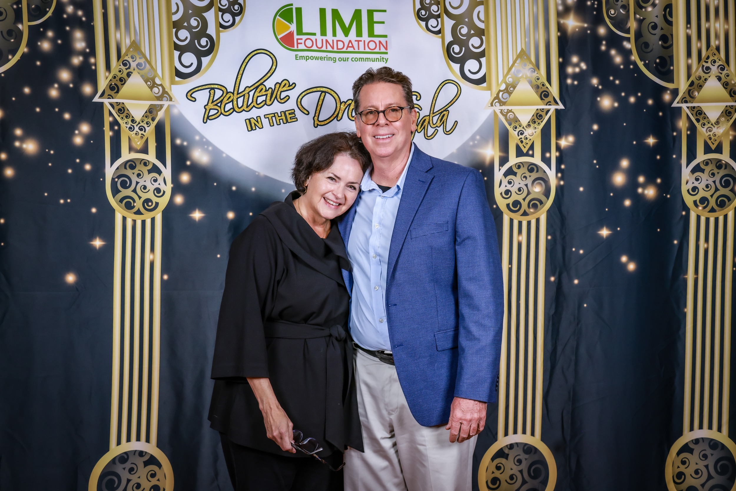A man and woman posing for a photo at a party hosted by The LIME Foundation of Santa Rosa.