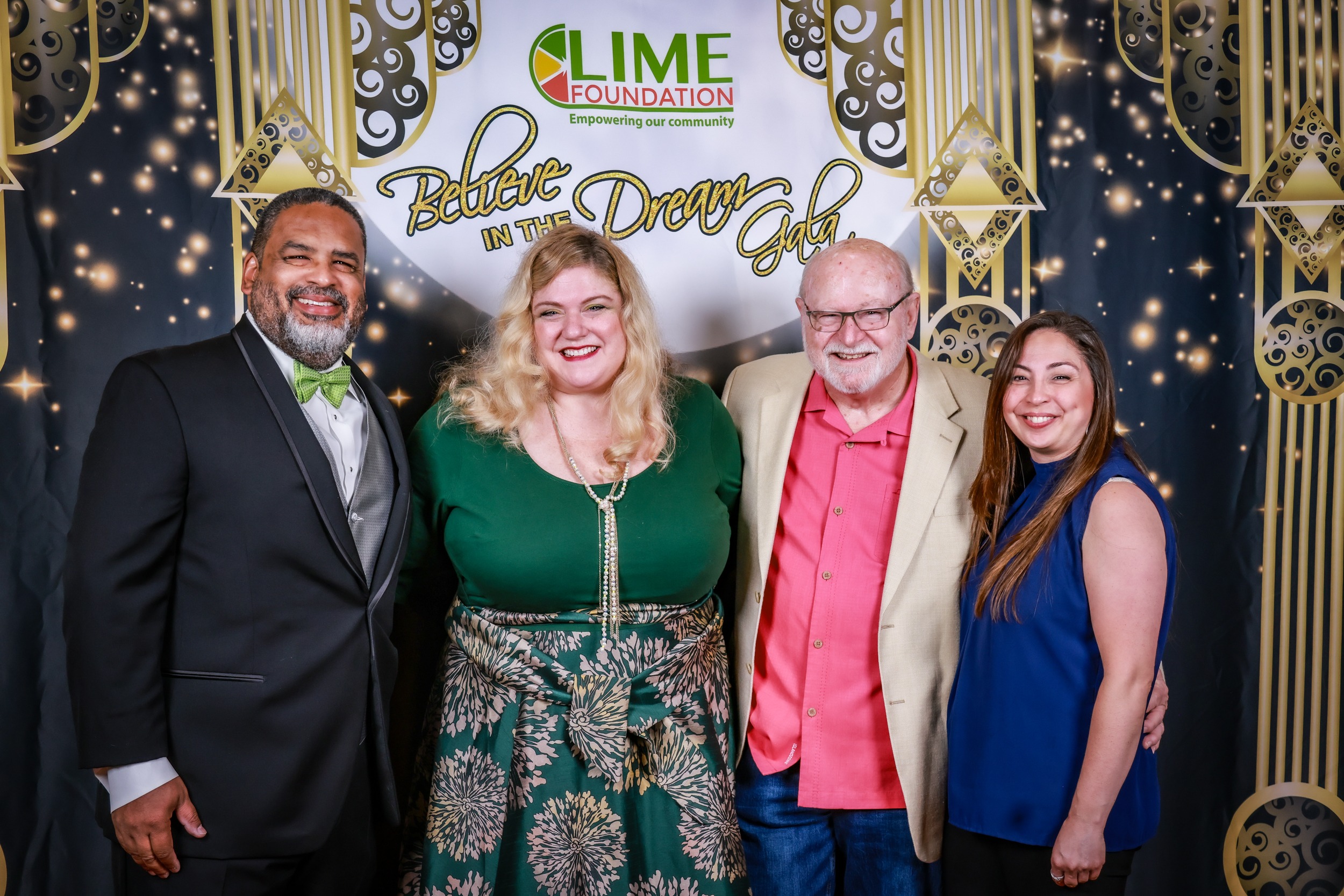 A group of people posing for a photo at The LIME Foundation event.