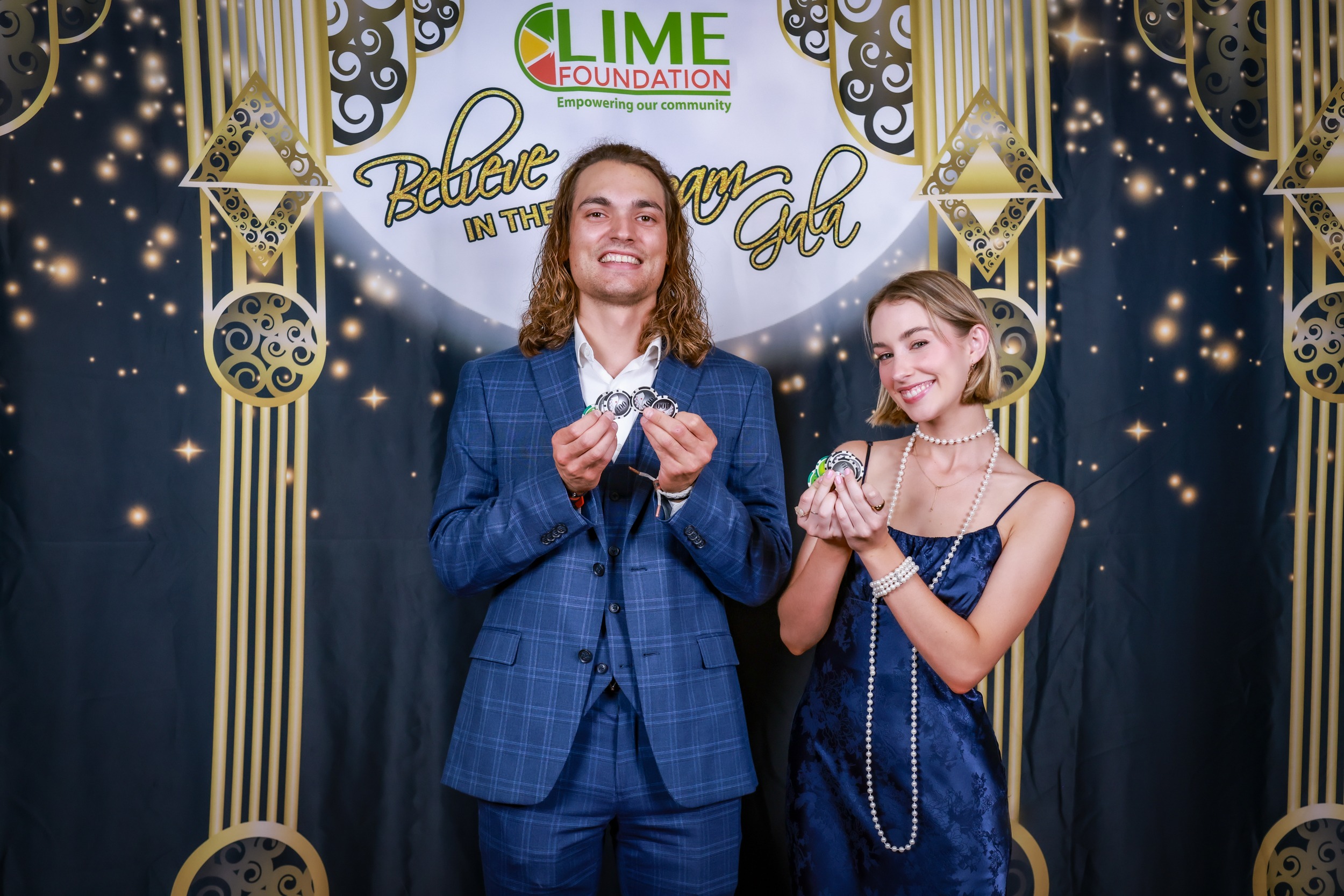 A man and a woman pose for a photo at a party hosted by The LIME Foundation of Santa Rosa, a Sonoma County Non-Profit Organization.